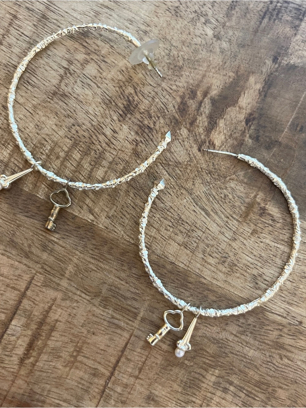 Kendra Scott gold hoops with charms